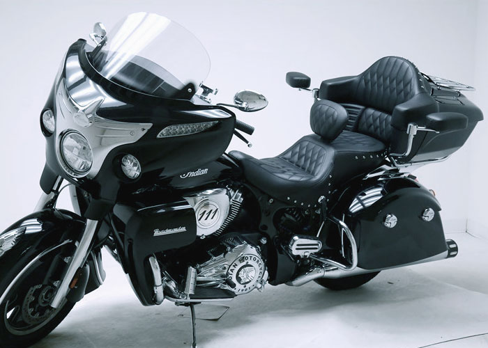 Black and white photo of Indian motorcycle with back rider seat