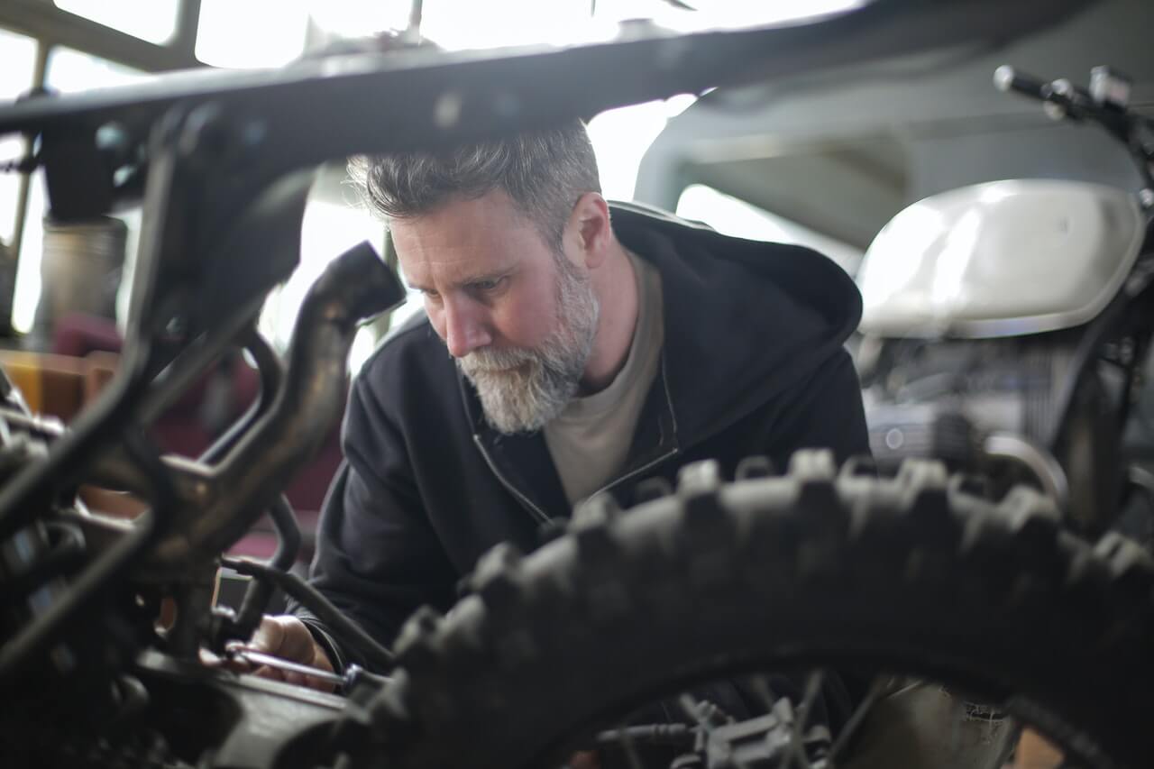 Cleaning spark plug on motorcycle