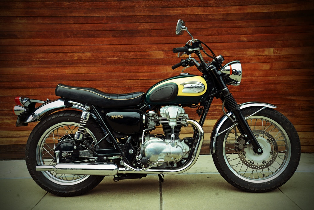 A yellow and black Kawasaki motorcycle.