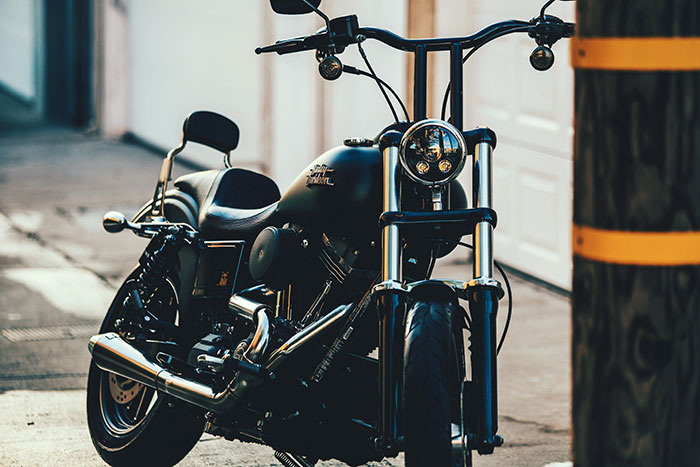 A black Harley-Davidson Cruiser sits parked