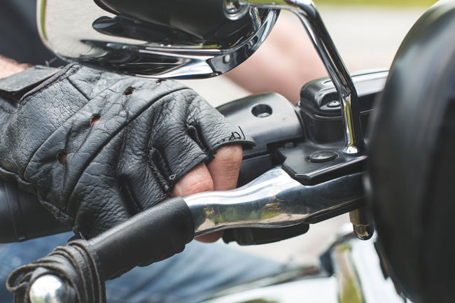 leather gloves on motorcycle rider