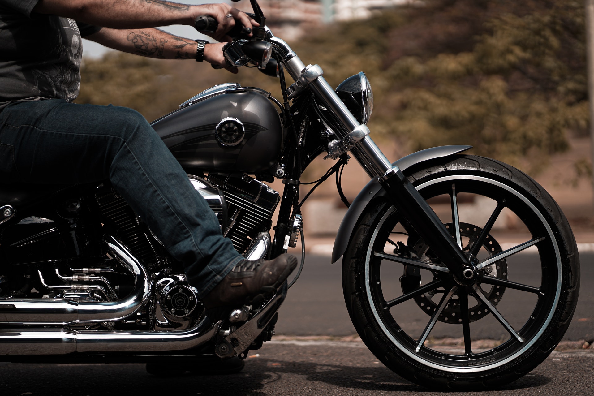 Man in jeans riding motorcycle