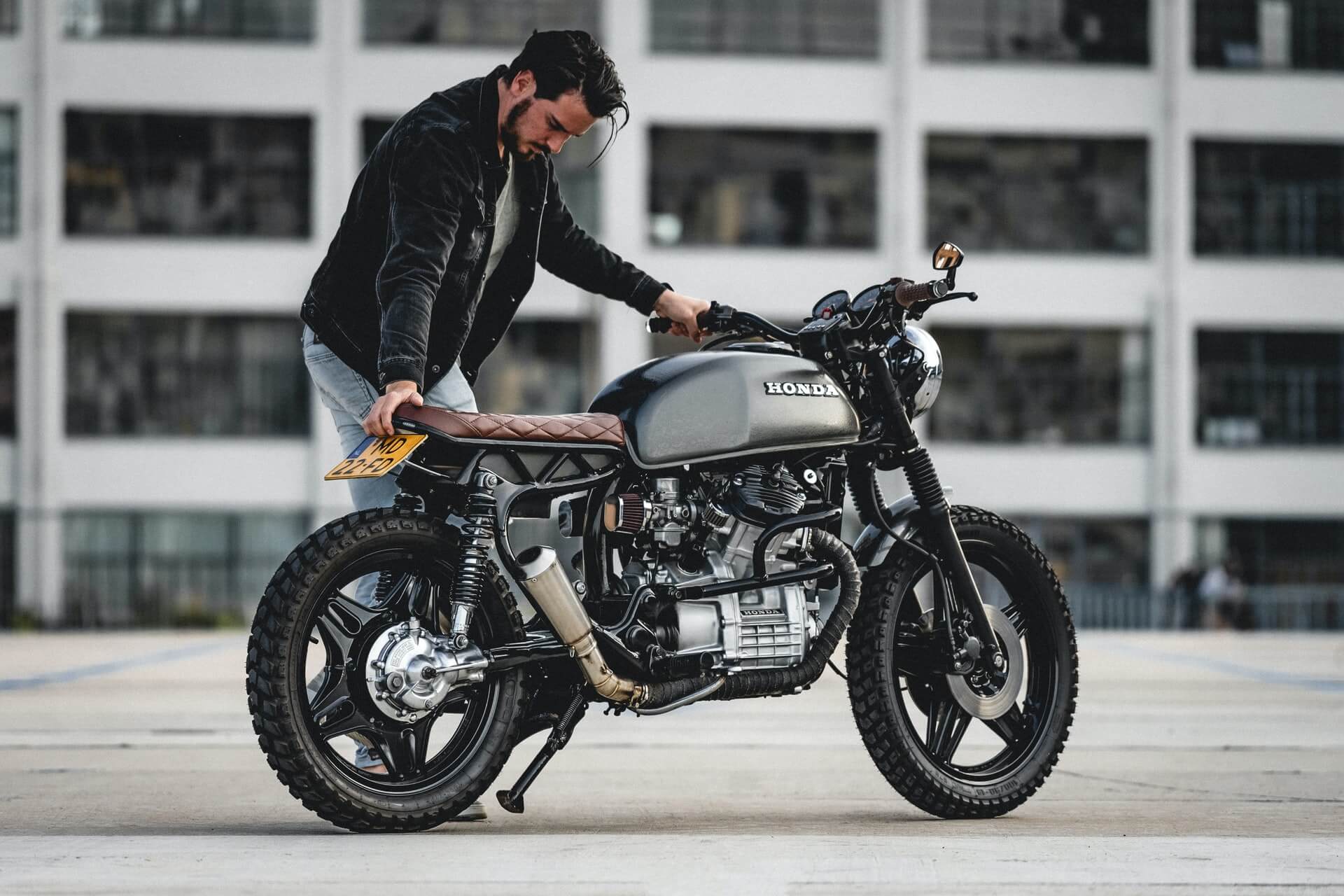 Man looking at his reupholstered motorcycle seat