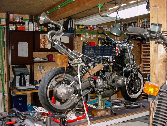 replacing motorcycle tires in repair shop