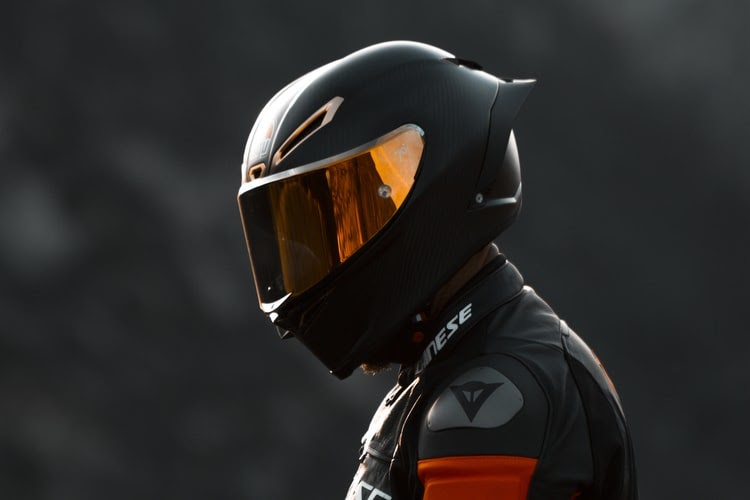 Motorcycle rider in a black helmet