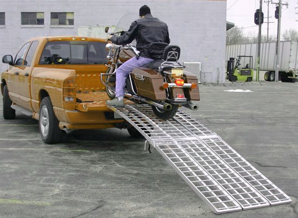 towing a motorcyle by a pickup truck