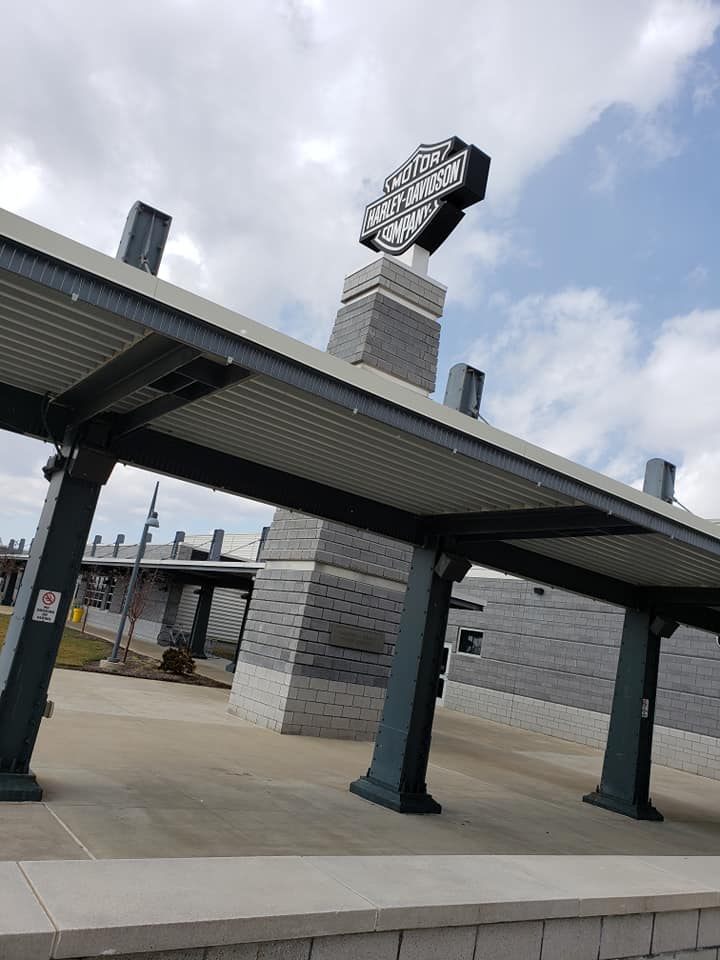 The Harley-Davidson Motor Company sign at its York, PA factory, seen next to an awning.