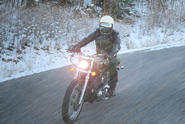 man riding motorcycle at highspeed under windchill temperature