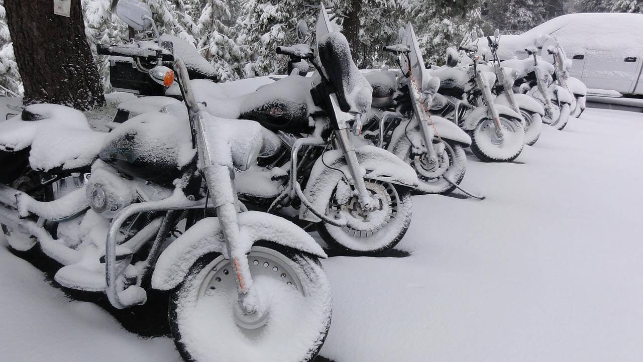 Harley Davidson bikes all covered in snow