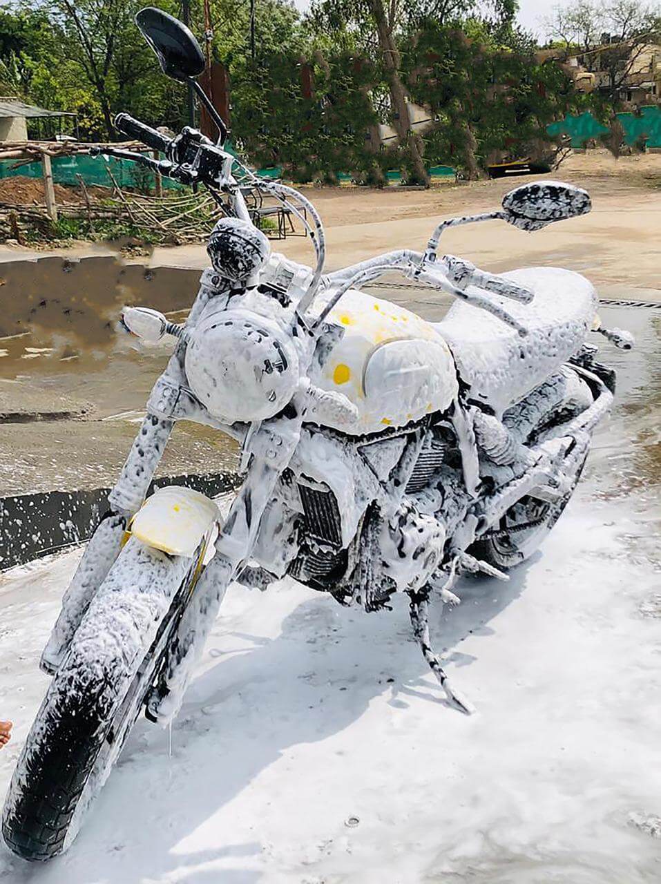 Motorcycle being washed with sudsy soap