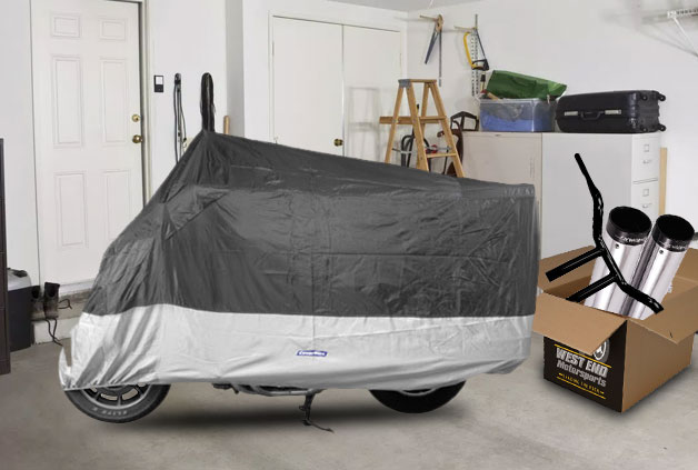 A motorcycle covered under a tarp is stored indoors for winter.